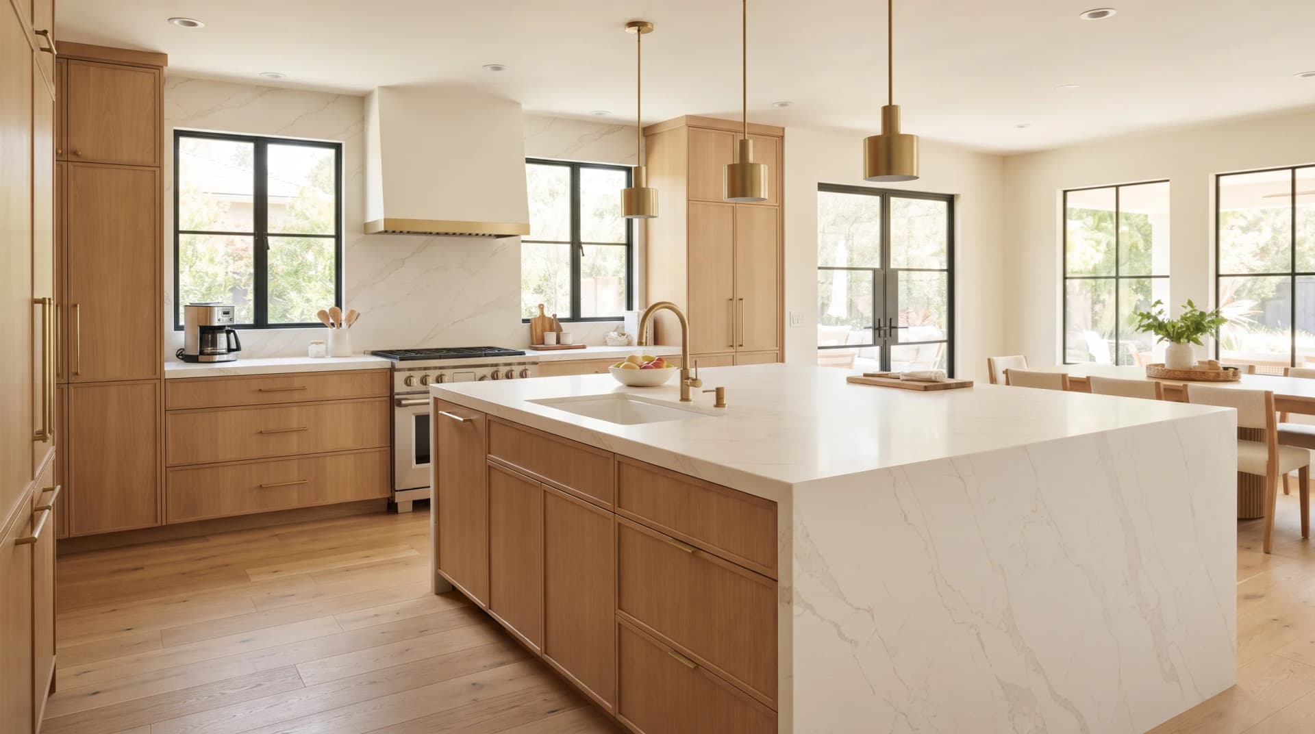 Bright modern Canadian kitchen with large-format marble-look porcelain countertops on the perimeter and island
